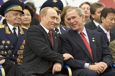  President Bush and Russian President Vladimir Putin laugh during a Red Square military parade. Photo:/AP 