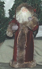 This santa stands approximately 27cm tall