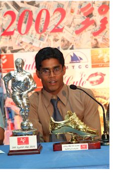 Ali-Shiham with the Maldivian Footballer of the year 2001 trophy and Haveeru's "Golden Boot" for the season's top goal scorer