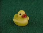 This duck has Pacman eyes with eyebrows and a red beak. It's plastic feels a bit different too