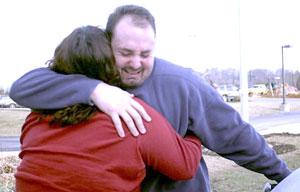 Associated Press Photo: Mike Osborne, of Lexington, hugs his mother, Debbie White, after being released from jail at the Hardin County Dentention Center in Elizabethtown Wedensday, Dec. 18, 2002. Hundreds of convicted felons were released across the state due to the Gov. Patton's budget cuts. 