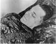 A head shot of Pretty Boy Floyd lying in his casket