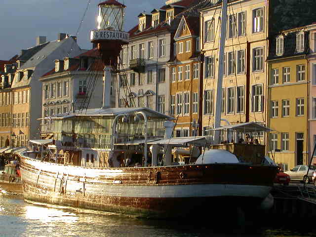 The beautiful golden summer afternooned canals of Nyhavn, Copenhagen, Denmark