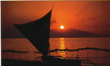 sunset at Lovina beach with local dinghy