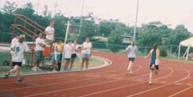 Paula crossing the finish line