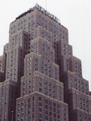[looking up at the New Yorker Hotel]