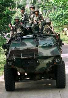 Philippine Army soldiers aboard APC somewhere in Basilan searching for the Abu Sayaf kidnappers