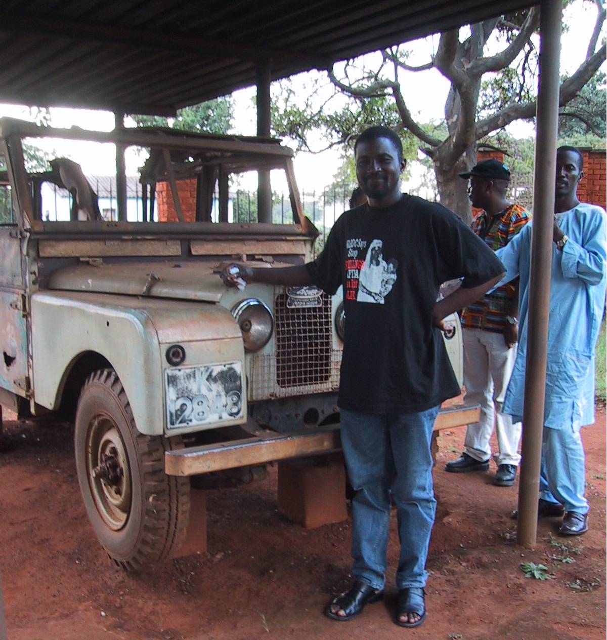 In Lusaka, Zambia April 2002, standing in front of the jeep