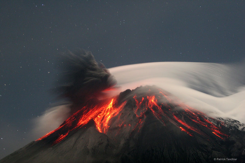 Tungurahua Erupts  Image Credit & Copyright: Patrick Taschler  Explanation: Volcano Tungurahua sometimes erupts spectacularly. Pictured above, molten rock so hot it glows visibly pours down the sides of the 5,000-meter high Tungurahua, while a cloud of dark ash is seen being ejected toward the left. Wispy white clouds flow around the lava-lit peak, while a star-lit sky shines in the distance. The above image was captured in 2006 as ash fell around the adventurous photographer. Located in Ecuador, Tungurahua has become active roughly every 90 years since for the last 1,300 years. 