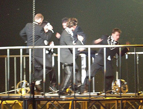 The guys twisting during 'Twist and Shout'