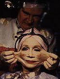 Katherine Helmond as a woman addicted to plastic surgery
