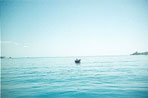 wide blue open sea plus boat