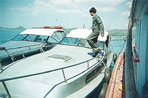 thai cops in speedboats