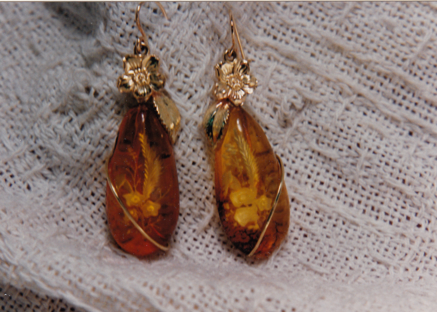 Matching pieces of Amber set in 14 karat gold earring settings.