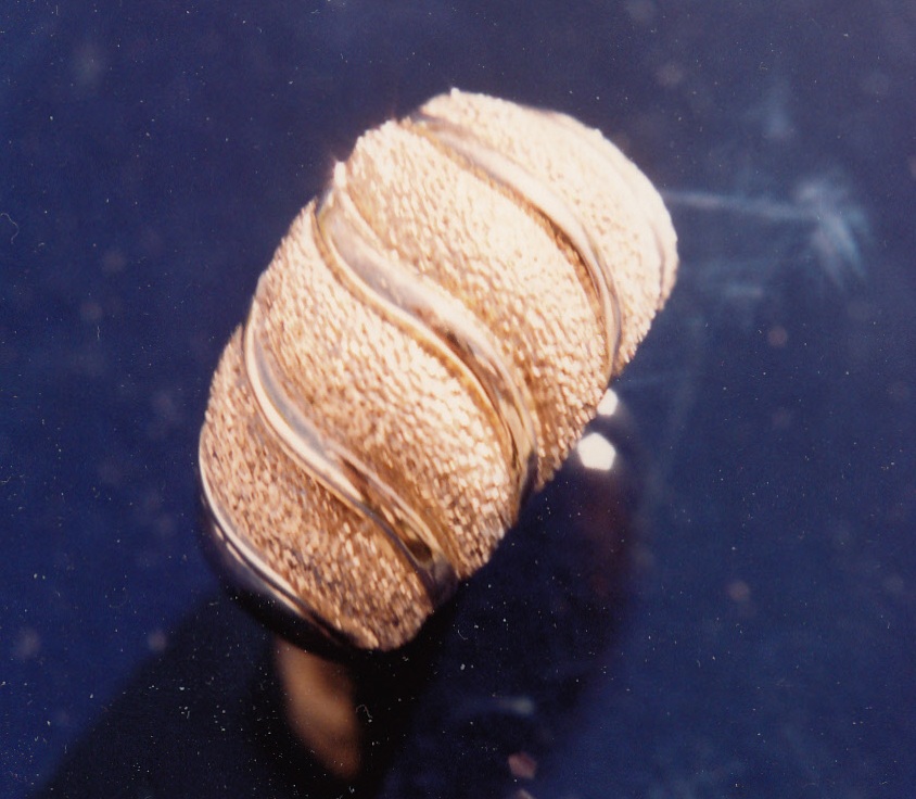 Sculpted gold ring.