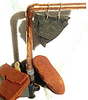 pump, copper pipe, hanging slate assembly