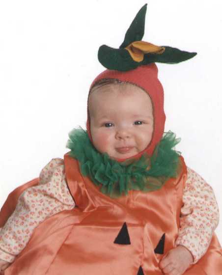 Our little pumpkin looking adorable in her little pumpkin costume