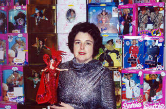 Kitturah surrounded by her Barbie dolls!