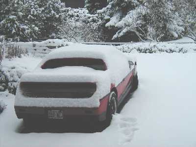 Fiero parked in the snow in Pontiac Michigan