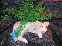 Gray/white glazed, ceramic cat self sleeper witb butterfly and air fern.