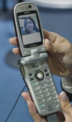 Displayed at the CeBIT America technology trade show at the Jacob Javits Center in New York, N.Y., the P2102V cellphone made by the Japanese mobile communications company NTT DoCoMo, is equipped with two cameras, one above the screen at top right, and one on the side, Thursday, June 19, 2003. With the industry in the doldrums, it's a bad time for technology trade shows. But that hasn't deterred CeBIT, organizer of the world's largest tech fair, from holding its first American show.