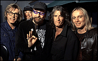 Joe Perry, second from right, celebrates his 50th birthday at Mount Blue in Norwell with Cheap Trick band members, from left, Tom Petersson, Bun E. Carlos, Rick Nielsen and Robin Zander. (Staff photo by Matthew West)