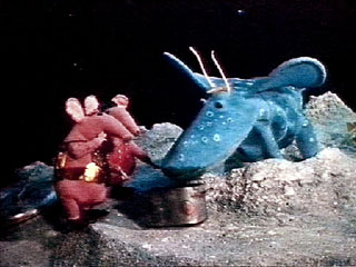 Skymoos being fed some soup by the Clangers
