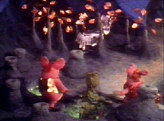 The Clangers and the Soup-Dragon watch the Iron Chicken from the Soup-Wells
