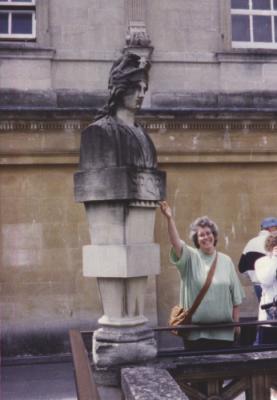 My mother in front of a statue in Bath, England