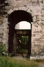 To the left of the main portal is another closed by a large iron grill