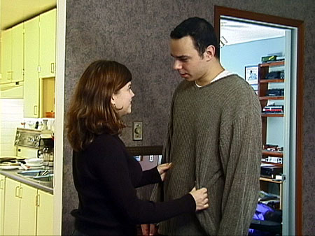 [Michelle (Janet Baldwin) wants to know more about Pual's (Erik Woods) trip to Europe.]