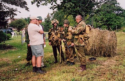 Director's Erik Woods and Tim Sullivan discuss the battle scene with the Canadian soldiers.