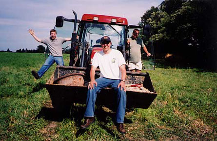 Scott Harris, Erik Woods and Tim Sullivan goofing around on the tractor