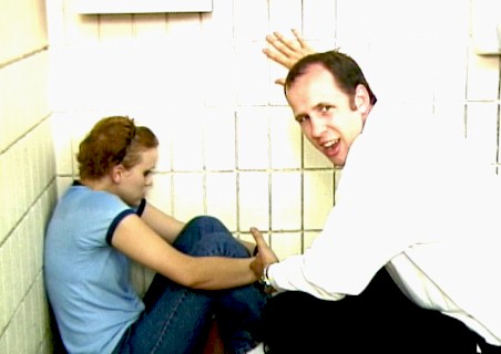 [Actors Jen Woods a nd Kris Nichols prrepare for the next shot]