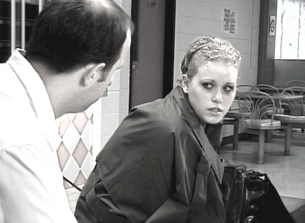 [Kris Nichols comforts Jen Woods in the empty train station]