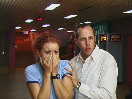 [THE MAN (Kris Nichols) comforts THE GIRL (Jen Woods) after seeing something frightening]
