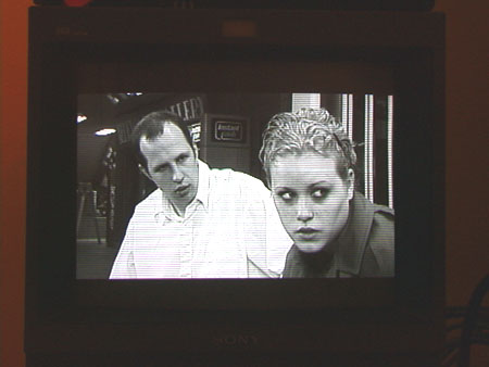 [The monitor displays the image of one of the scenes from Three on a Match]