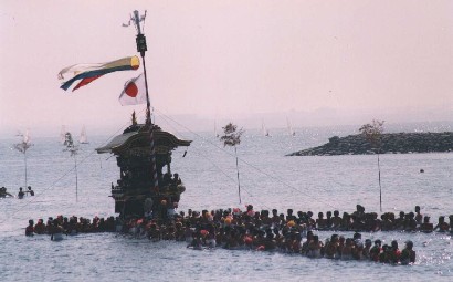 Mikoshis entering water for benediction