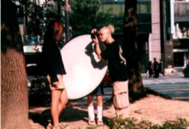Japanese model being photographed by punk