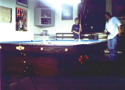 Mike Bozeman and son JT on snooker table in front area