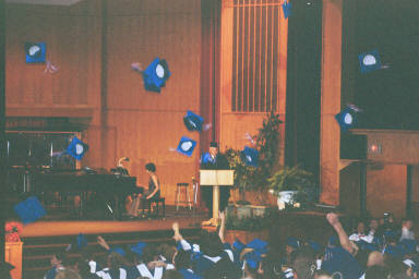 the traditional hat toss ending Chelsea's Grad Ceremony