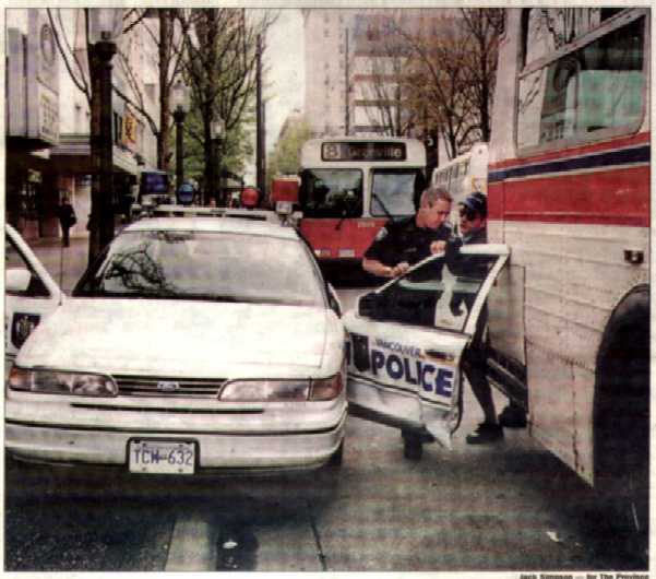Vancouver Sun Newspaper picture of a Vancouver police car door which opened into an on coming Translink Coach...a bus drivers dream come true