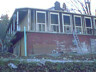 Right, front corner of the house