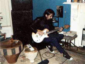 Paul Hammond plays guitar.