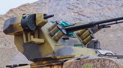 Turret with mounted grenade launcher