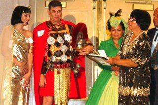 Josie Baron awards the $500.00 Grand Prize at the Masquerade Ball