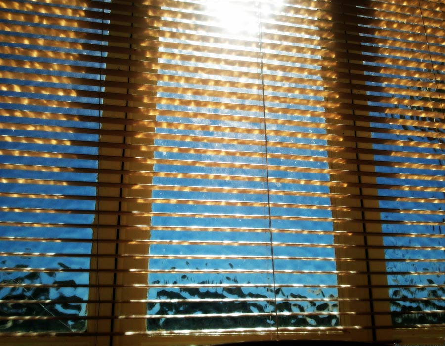 Sunshine raining though the blinds