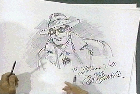 Will signs the sketch for Stan