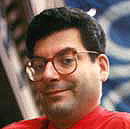 click photo to visit Michael's column at The Village
	 Voice!