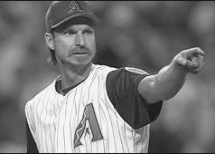 RJ pointing at IRS agent in the stands